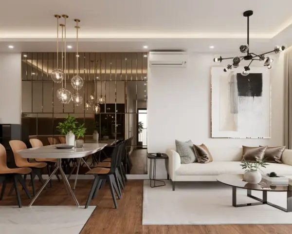 Nowoczesny bungalow z jadalnią i salonem. Lustrzana ściana odbija wiszące lampy, a wygodna sofa zaprasza do relaksu.