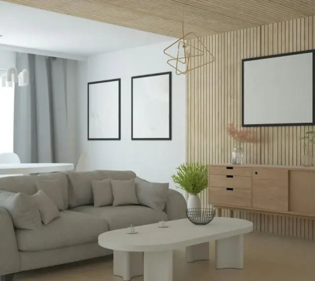 Nowoczesny salon z szarą sofą, drewnianą komodą i ozdobną **flizeliną** na ścianie.