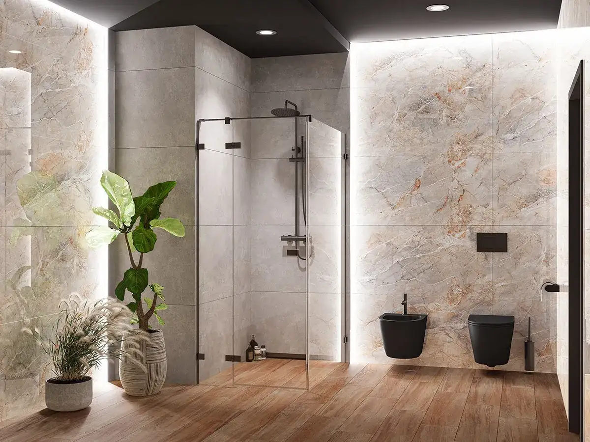 Nowoczesna łazienka z prysznicem walk-in. Deszczownica zamontowana na odpowiedniej wysokości, obok czarna miska WC i bidet.